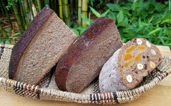 Rye bread. Pumpernickel bread. Fruits and Nuts bread. Served in an Indigenous African basket.